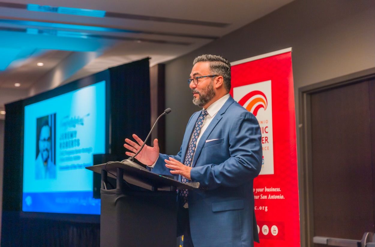 Dr. Jeremy Roberts speaking at a San Antonio Hispanic Chamber of Commerce event